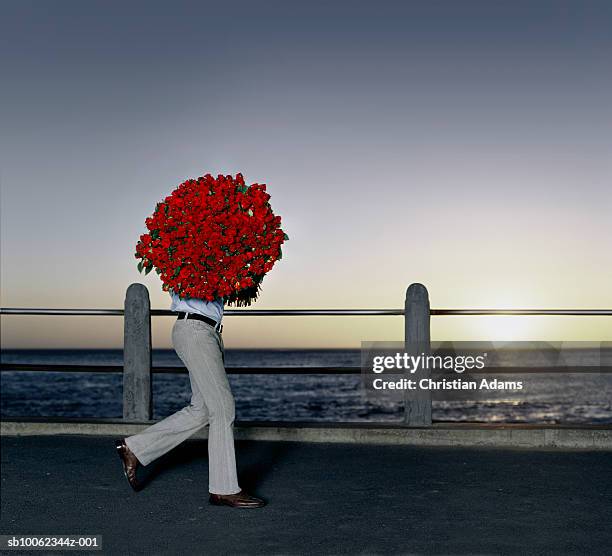 Man Carrying Roses Christian Rose Photos and Premium High Res Pictures - Getty Images