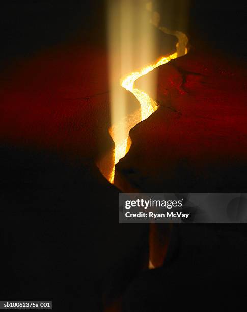 light shining through crack in lava rock, elevated view - lava bildbanksfoton och bilder