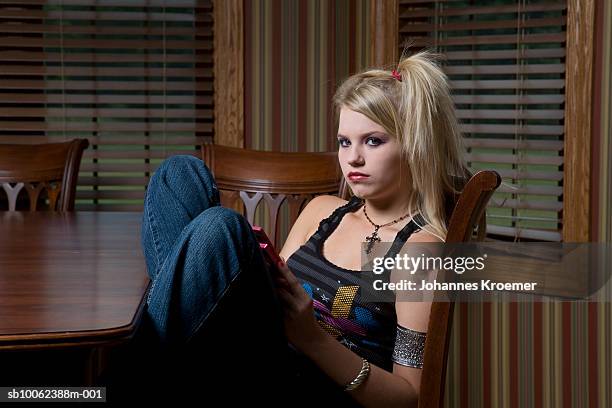 teenage girl (14-15) dressed up gothic, sitting at table, portrait - ゴシック ストックフォトと画像