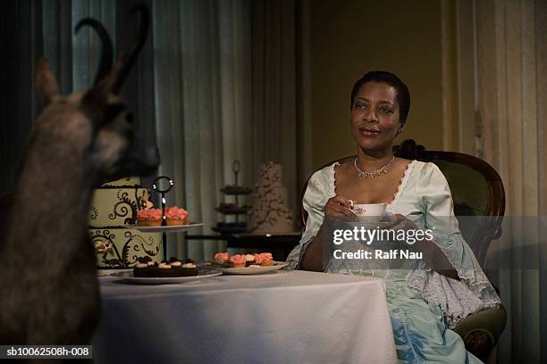 mature woman having tea, smiling - tea set stock pictures, royalty-free photos & images