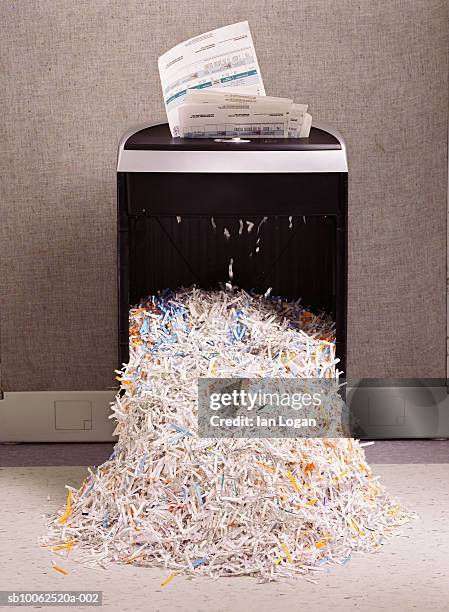 overflowing paper shredder - shredded paper stock pictures, royalty-free photos & images