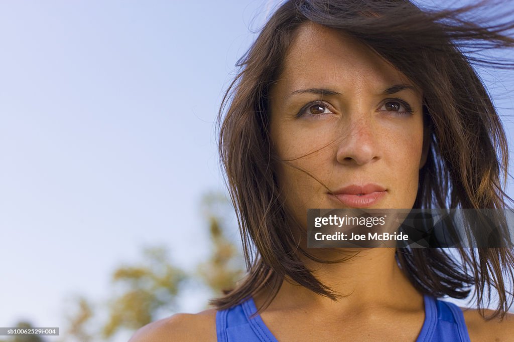 Windswept woman outdoors, close-up