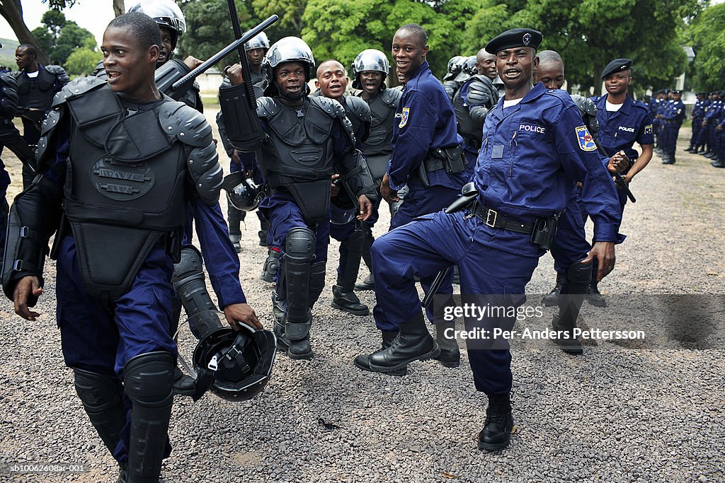 Riot policemen dancing and singing after demonstration