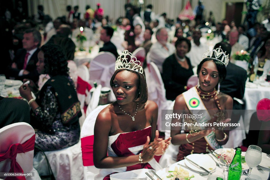 Two beauty queens clapping hands at Miss Congo Contest