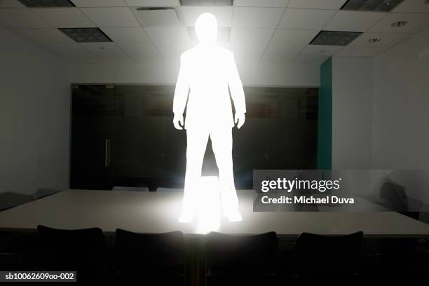 businessman standing on conference table with briefcase - conference table stock illustrations