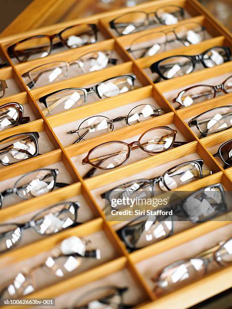 display case of eyeglasses, close-up, high angle view - accessoire de spectacle stockfoto's en -beelden