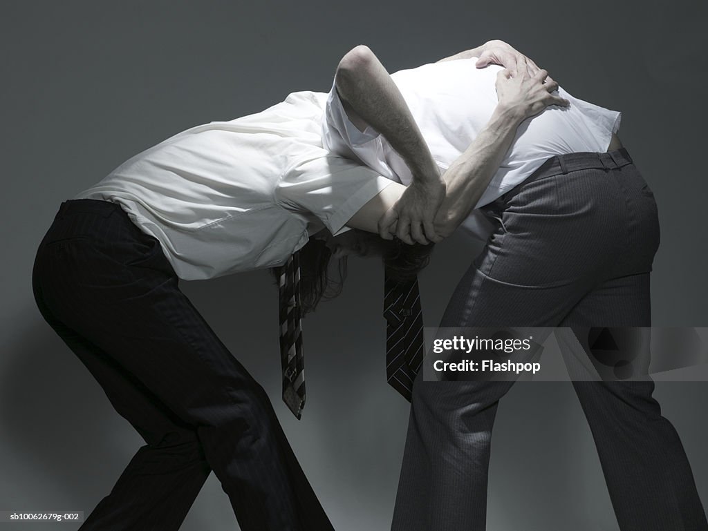 Two businessmen fighting
