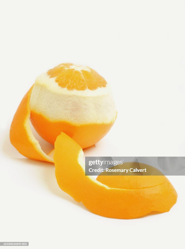 Orange with partly removed peel, close-up