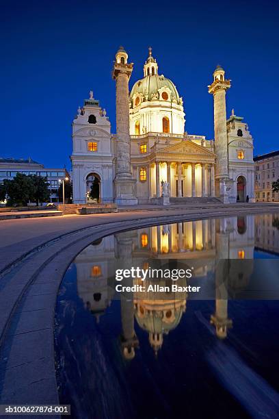 austria, vienna, karlskirche with pool in foreground - karlskirche stock-fotos und bilder