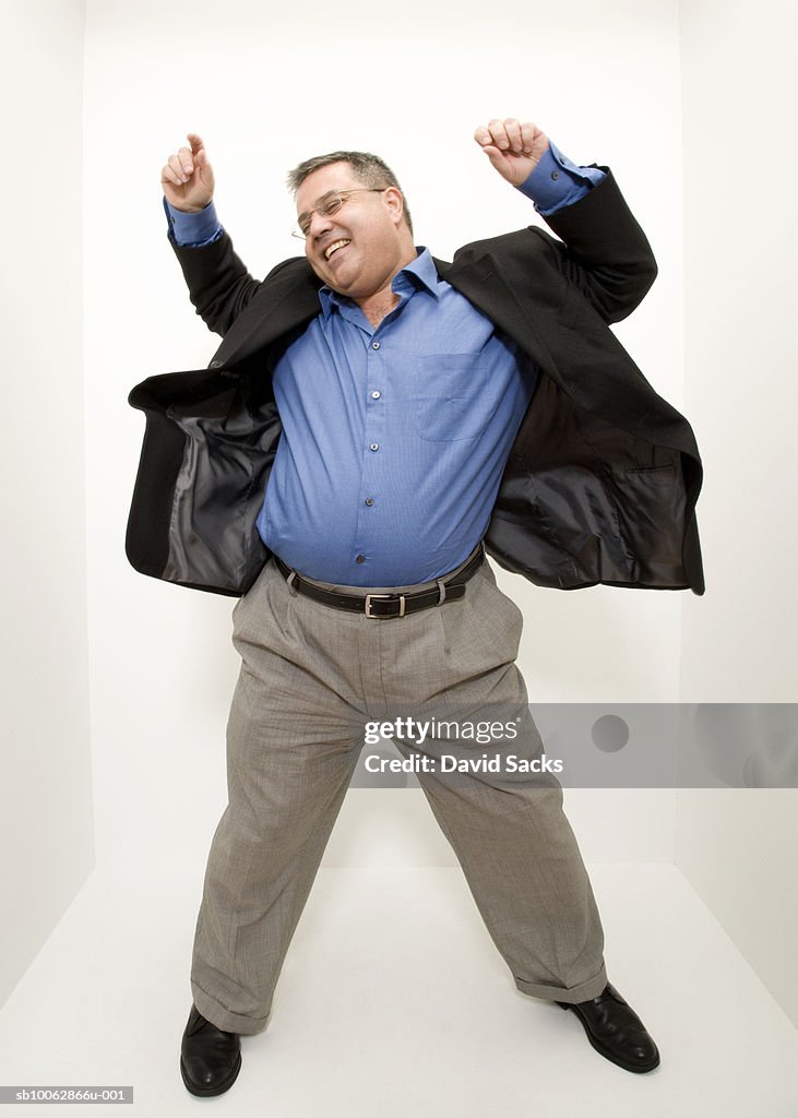 Mature man dancing in studio, high angle view