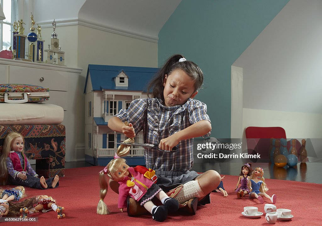 Girl In Room Cutting Dolls Hair High-Res Stock Photo - Getty Images