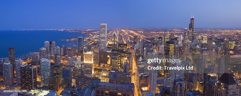 USA, Illinois, Chicago, elevated view of downtown Chicago and Lake Michigan at dusk