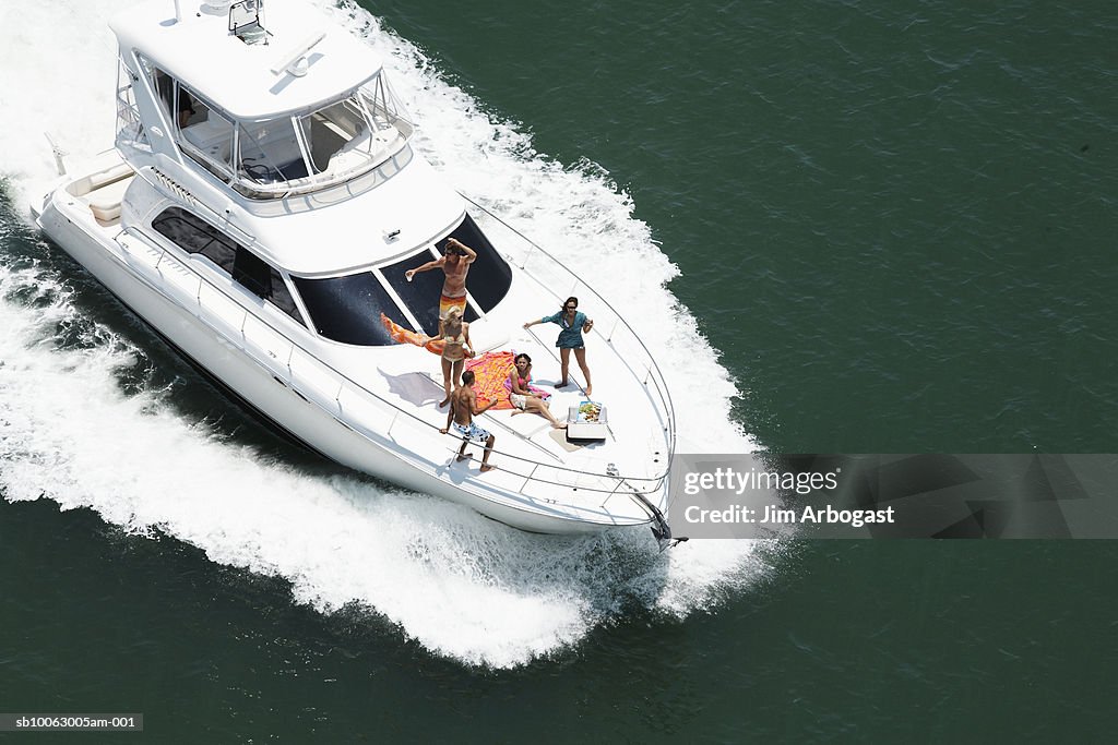 Group of people on speedboat at sea, aerial view