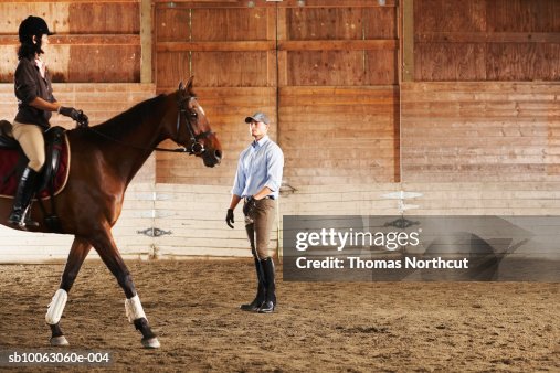 Man Standing Rider Young Man Standing Next To Rider And Her Horse In A Training Stable ...