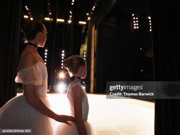 two ballerinas standing in wings - backstage 個照片及圖片檔