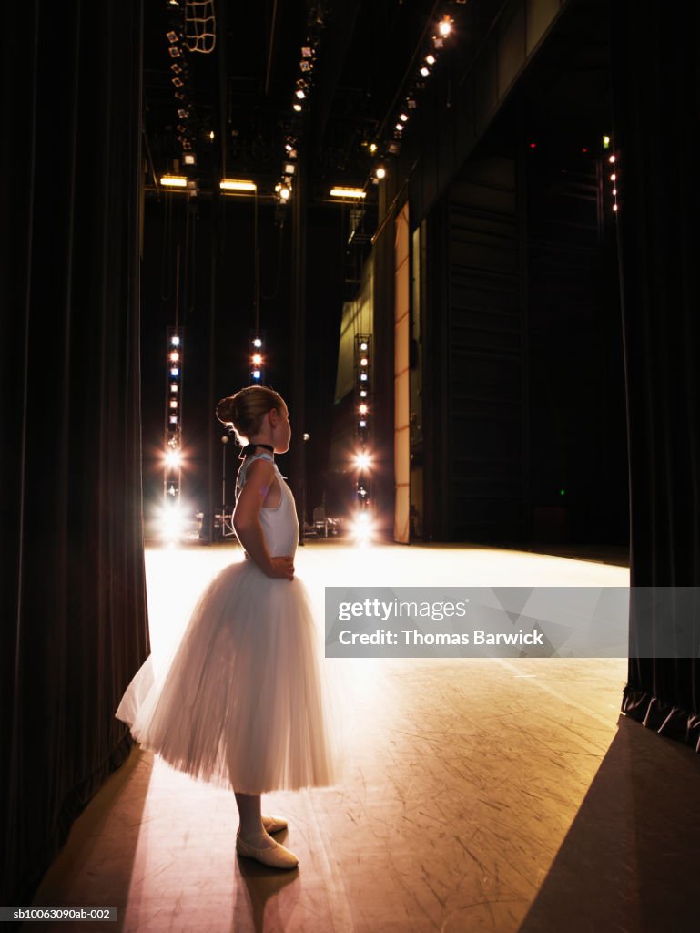 Young ballerina waiting in wings