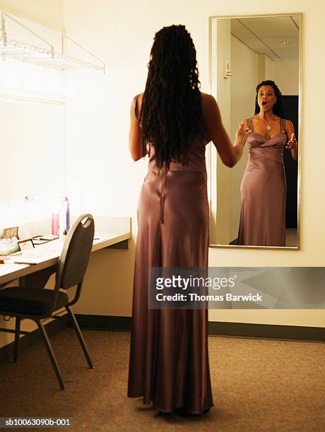 female opera singer warming up in dressing room mirror - backstage mirror stock pictures, royalty-free photos & images