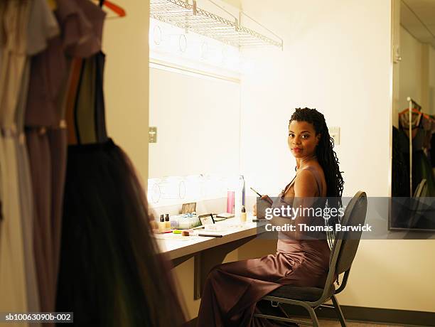 female opera singer sitting in dressing room, smiling, portrait - backstage mirror stock pictures, royalty-free photos & images