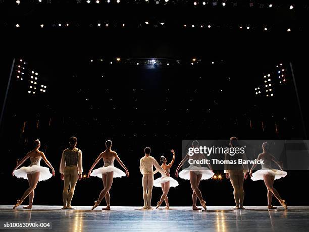 ballet dancers receiving applause on stage, rear view - bale imagens e fotografias de stock