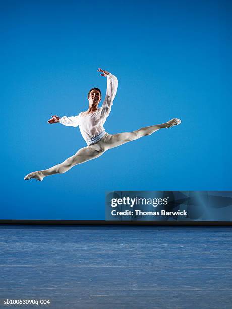 Leaping Example 465 Ballerina Leaping Across Stage Stock Photos, High-Res Pictures, and ...