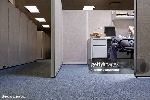 woman sitting in office, low section - office partition stock-fotos und bilder
