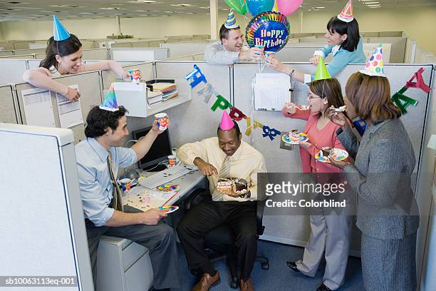 office workers celebrating birthday party, elevated view - office party stockfoto's en -beelden