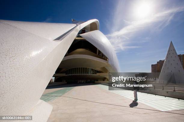 spain, comunidad valenciana, valencia, man standing in city of arts and science - ciutat de les arts i les ciències stock pictures, royalty-free photos & images