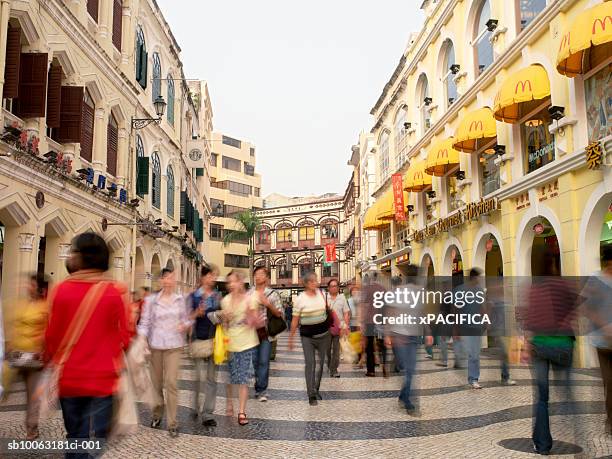 china, macau, tourists walking in leal senado street - macao fotografías e imágenes de stock