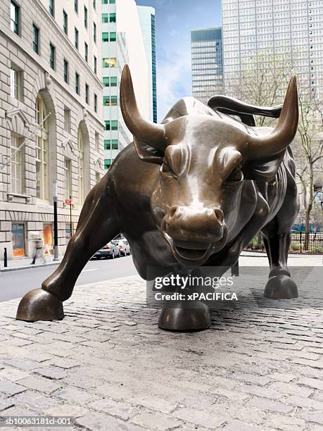 usa, new york, new york city, wall street, bronze statue of charging bull - charging bull statue stock pictures, royalty-free photos & images