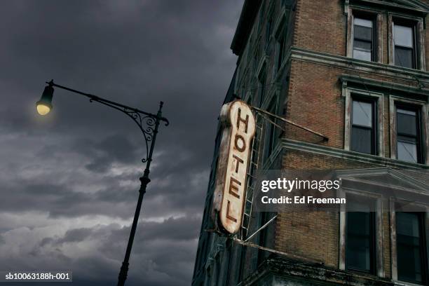 sign on abandoned hotel, low angle view - shop sign stock pictures, royalty-free photos & images