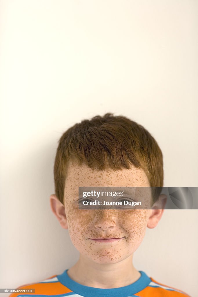 Portrait of boy (8-9 years) with freckles