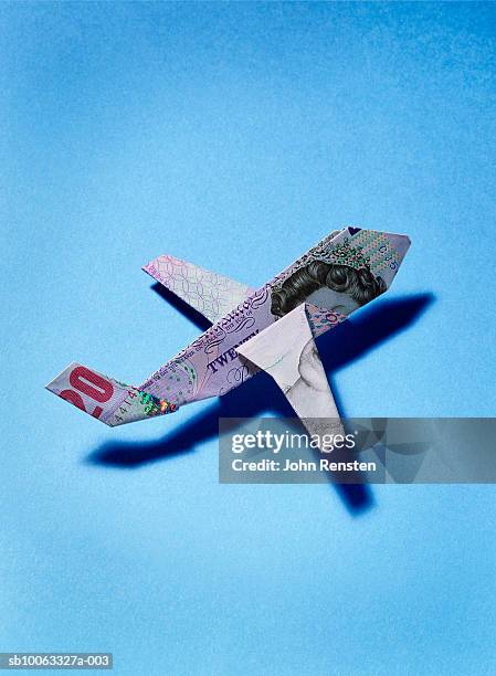 paper plane made from twenty pound banknote - origami stock pictures, royalty-free photos & images