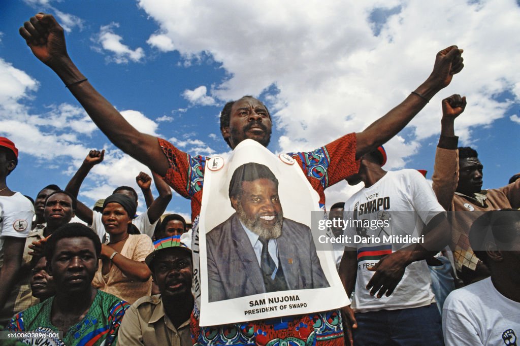 Africa, Namibia, group of supporters with candidates poster