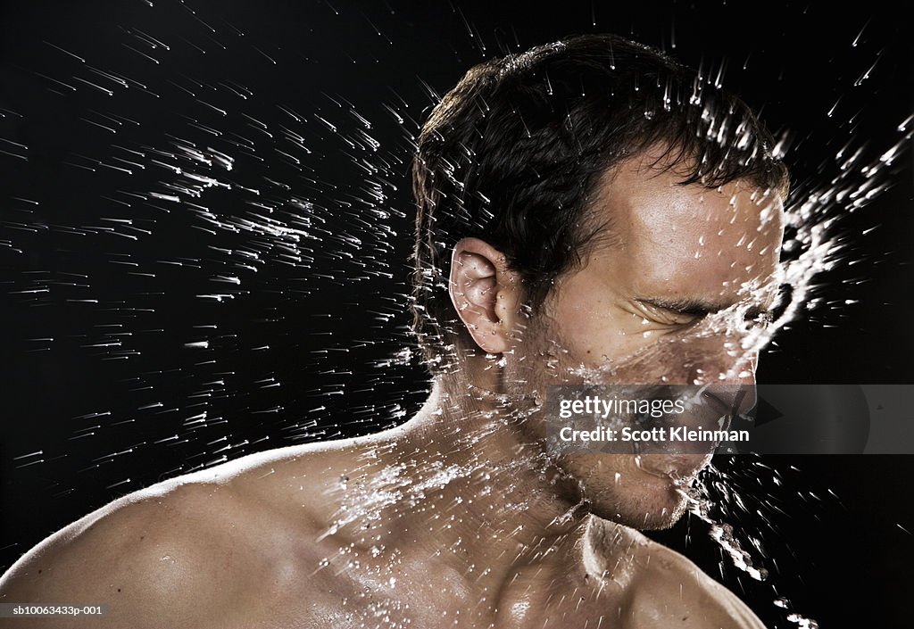 Man shaking off water, close-up