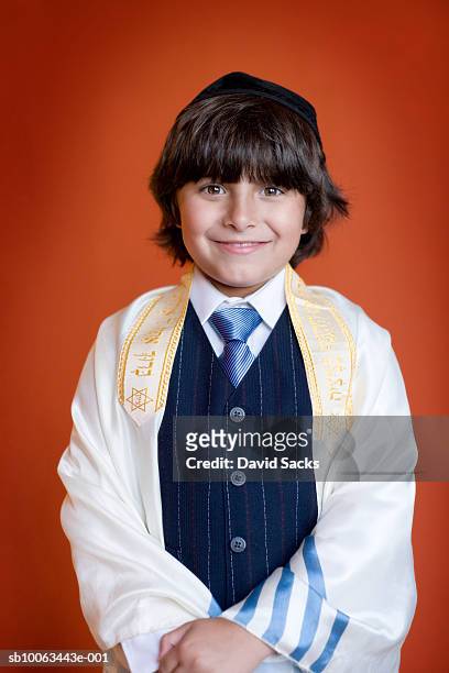 portrait of jewish boy (4-5) wearing tallith and scull cup, smiling - jewish prayer shawl stock pictures, royalty-free photos & images