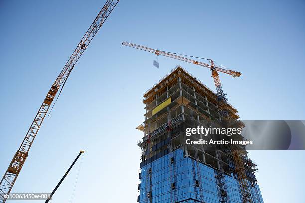 building under construction, low angle view - large building stock pictures, royalty-free photos & images