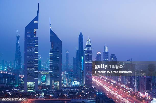 emirates towers and sheikh zayed road at dusk - emirates towers stock pictures, royalty-free photos & images