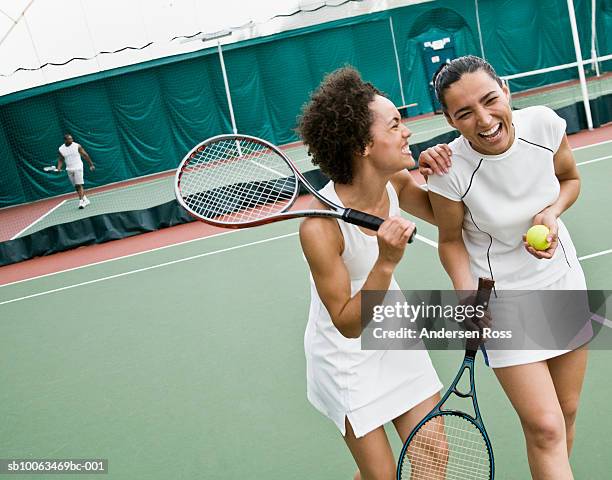 two women walking and laughing in tennis court - tennis woman stockfoto's en -beelden