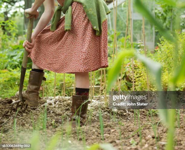 woman digging with garden fork, low section - gardening fork stock pictures, royalty-free photos & images