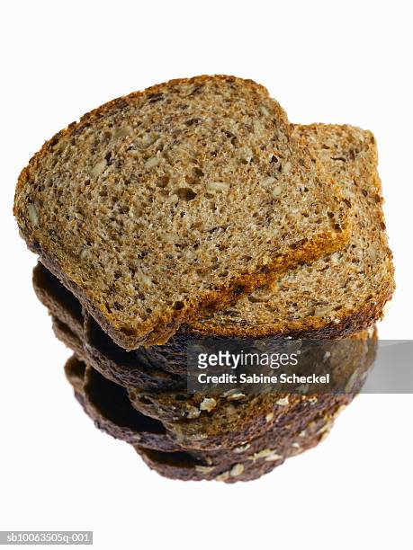 tower of sliced multigrain bread on white background, close-up - sliced bread tower stock pictures, royalty-free photos & images
