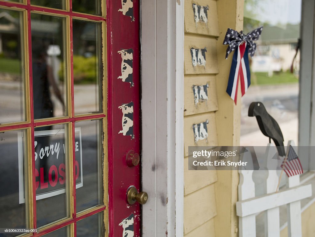 Close-up on shop's doors with cow stickers