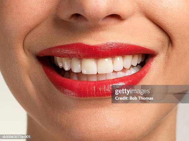 young woman smiling, close-up on mouth - menselijke mond stockfoto's en -beelden