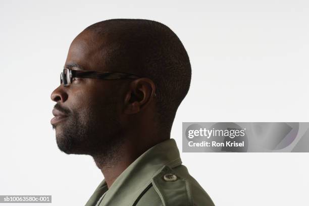 profile of young man against white background - shaved head profile stock pictures, royalty-free photos & images