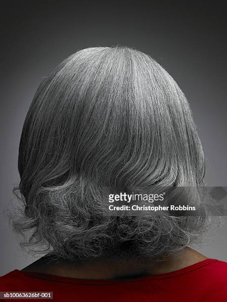 mature woman with grey hair, rear view, head and shoulders - back of womens heads stockfoto's en -beelden