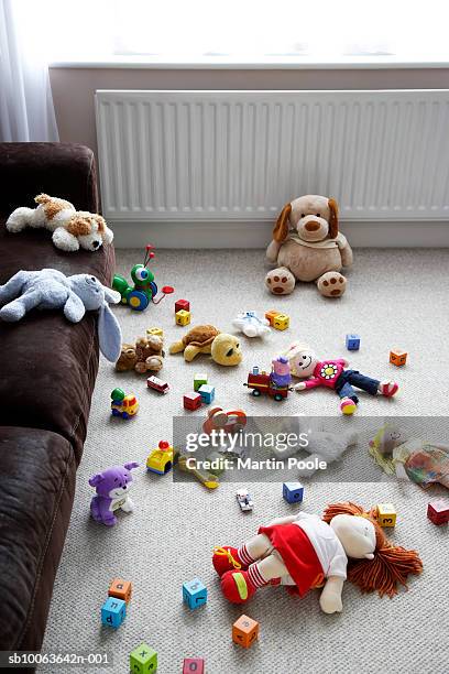 toys lying around living room floor, elevated view - kids mess carpet fotografías e imágenes de stock
