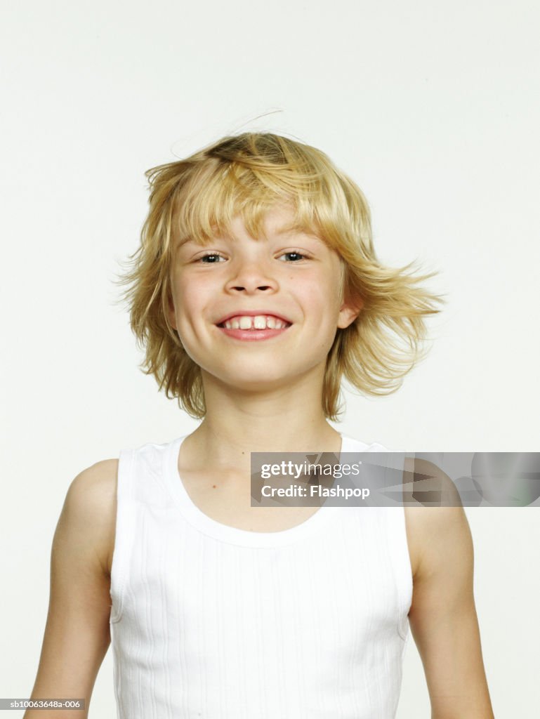 Boy (8-9) smiling, close-up, portrait