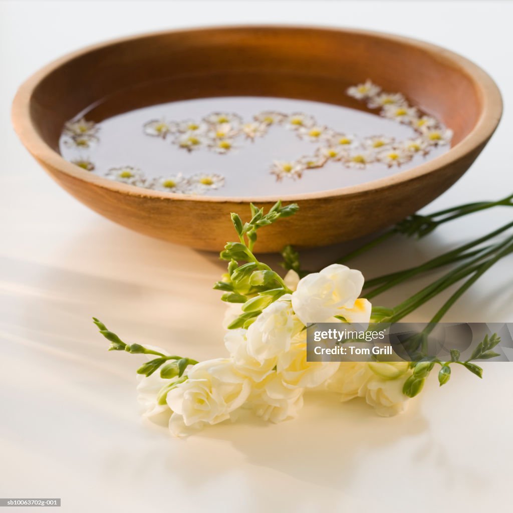 Flowers by bowl of water