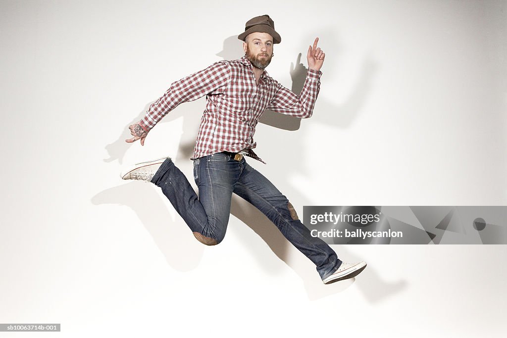 Man running mid-air, portrait