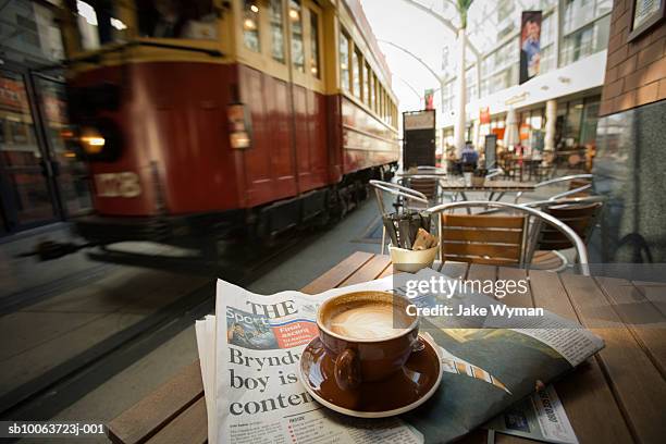 tram passing by outdoor restaurant - christchurch nieuw zeeland stockfoto's en -beelden