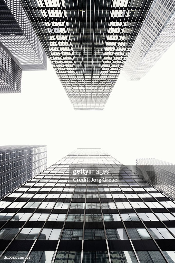 Office buildings against sky, view from below